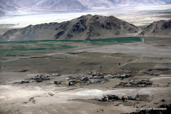 A village near Ganden overlooked by treeless slopes