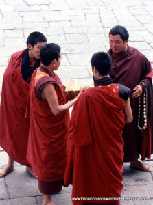 4 monks in courtyard